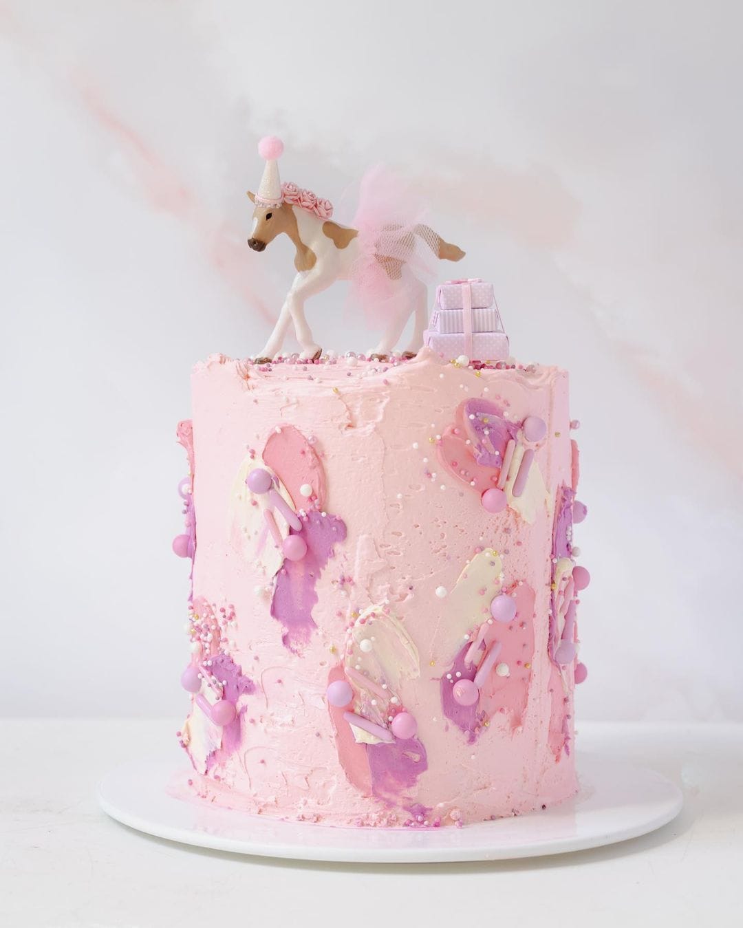 pink cake with horse statue photographed on Pink tile marble double-sided vinyl photography backdrop