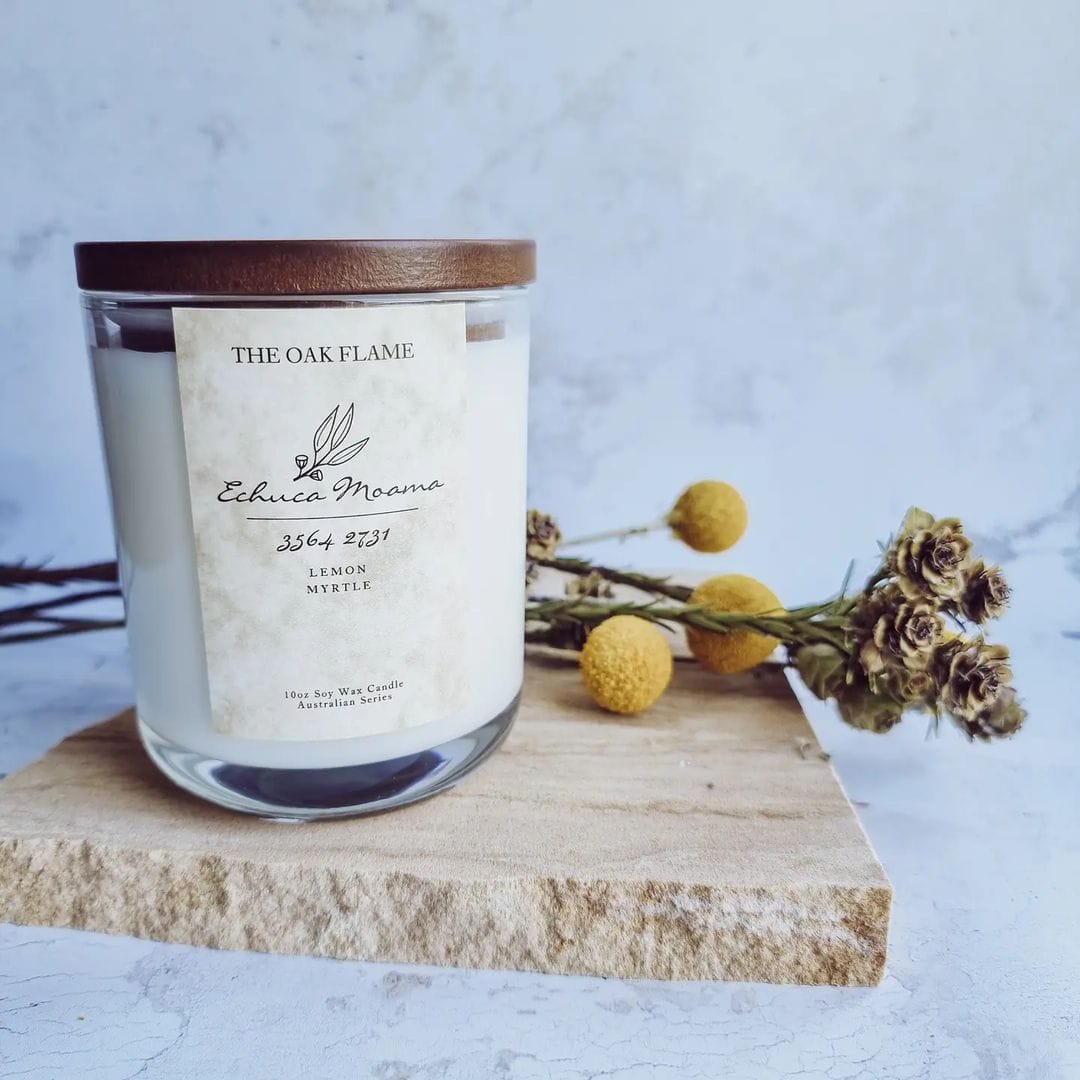 Natural soy wax candle with dried flowers photographed on Tuscan natural sandstone stone photography prop - backdrop collective Australia