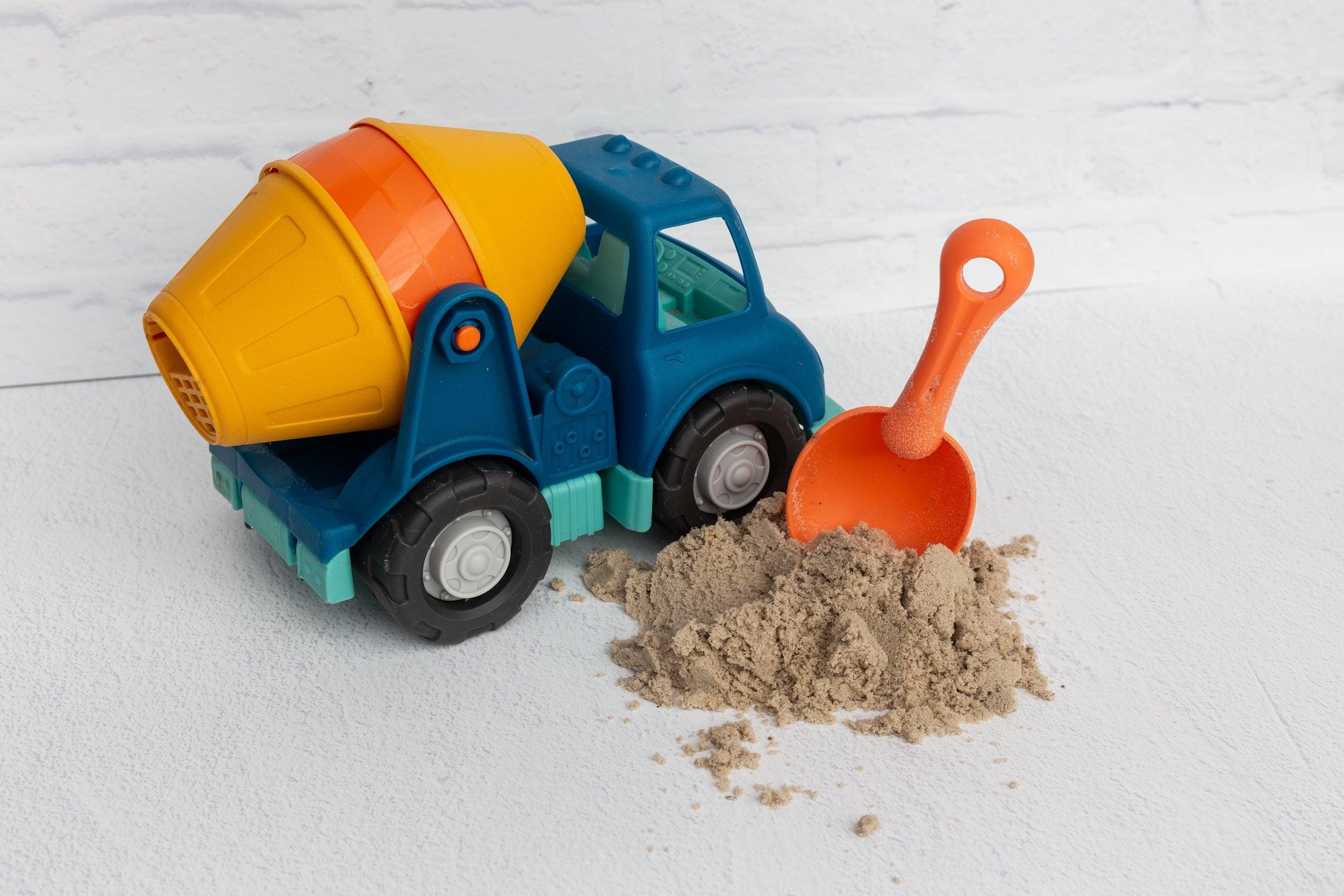 white brick and concrete double-sided photography vinyl backdrop photographed with toy truck and sand - backdrop collective
