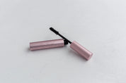 Too Faced better than sex mascara on white concrete double-sided vinyl photography backdrop - backdrop collective australia 