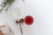 cocktail in crystal glass and cocktail set on white concrete double-sided vinyl photography backdrop - backdrop collective melbourne australia