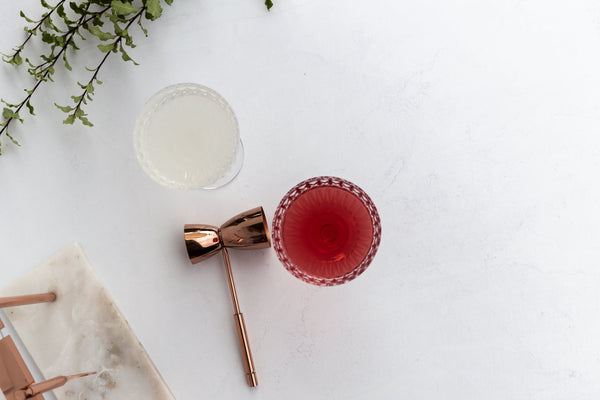 cocktail in crystal glass and cocktail set on white concrete double-sided vinyl photography backdrop - backdrop collective melbourne australia