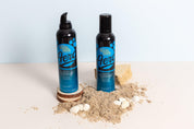 Mint Blue and beige double-sided photography vinyl backdrop with fake tan products and sand - backdrop collective