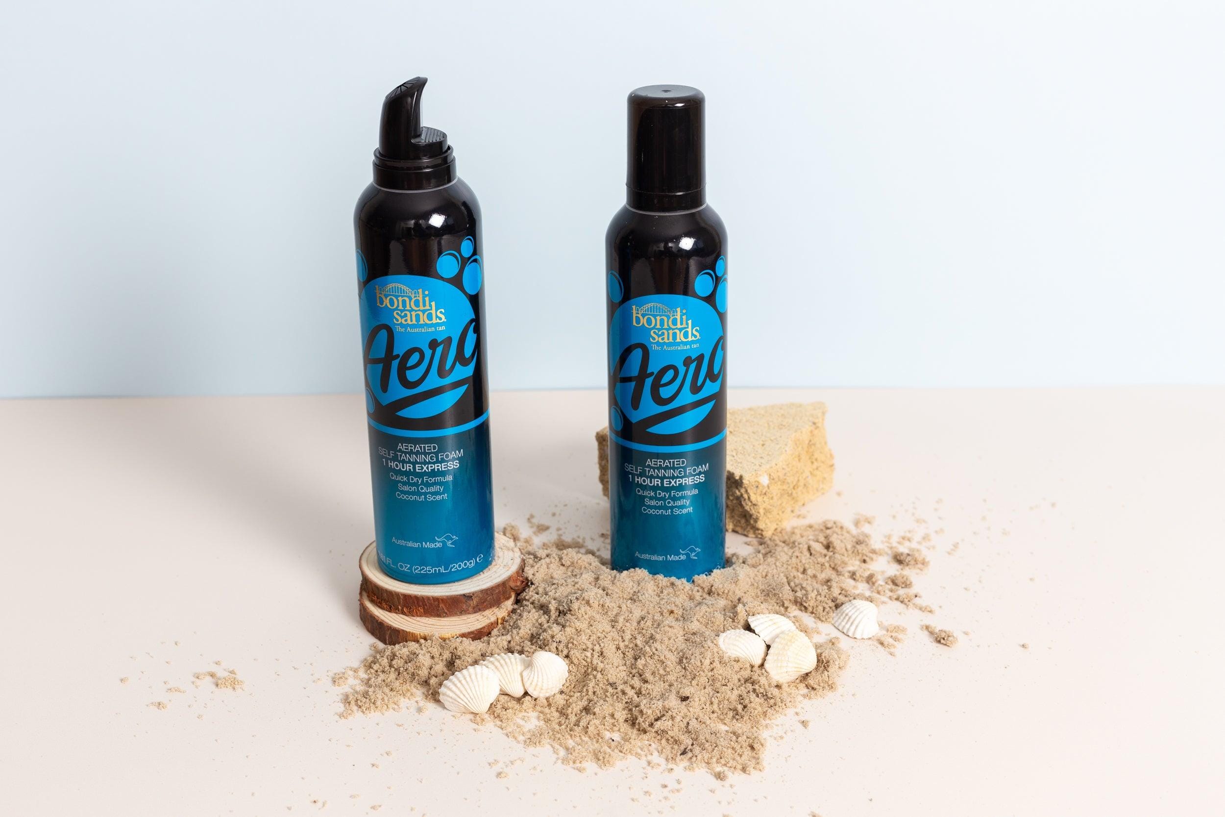 Mint Blue and beige double-sided photography vinyl backdrop with fake tan products and sand - backdrop collective