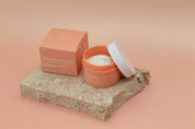 Travertine stone photography prop on peach and beige vinyl backdrop with go-to moisturiser  - backdrop collective melbourne