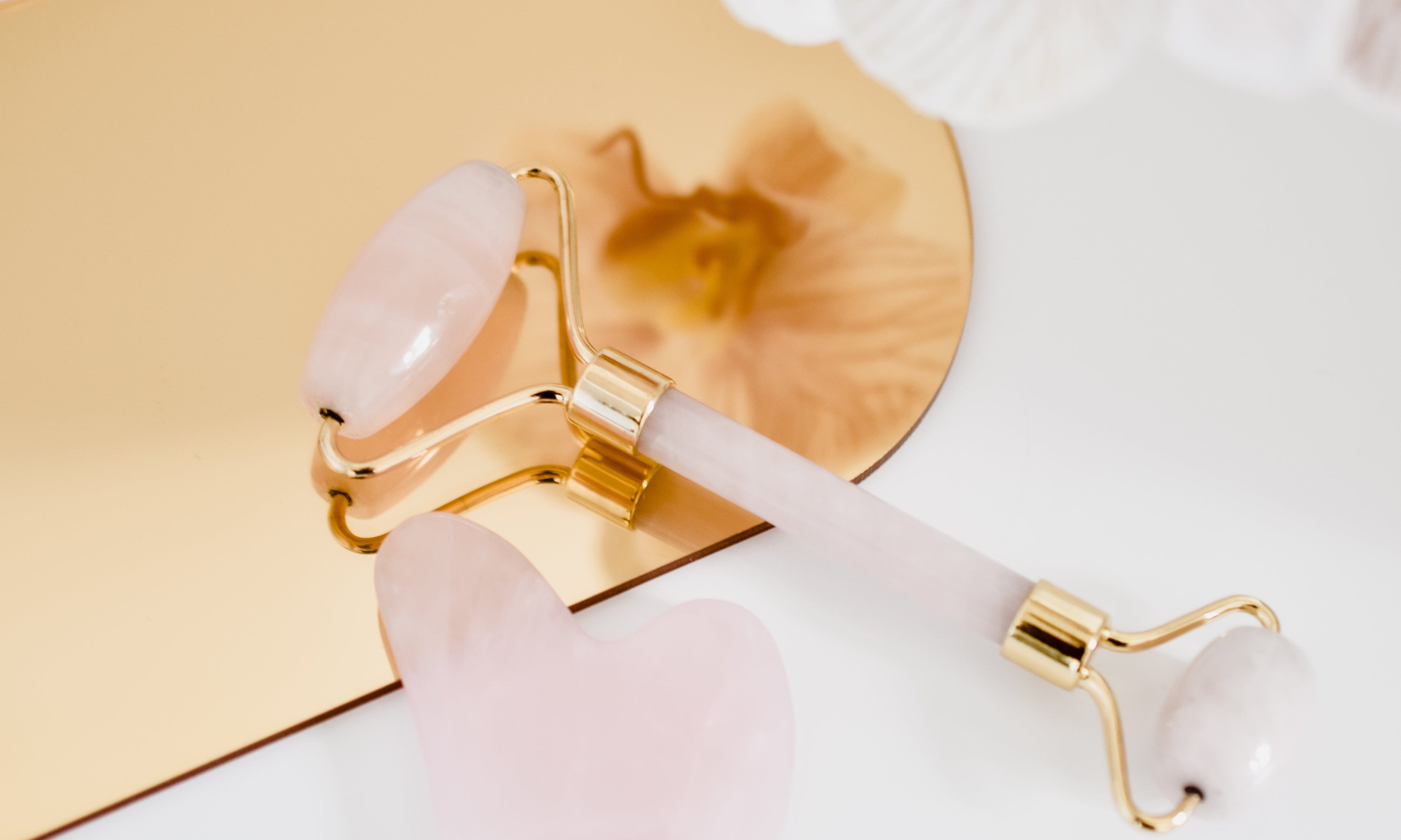 beauty tools on rose gold mirror arch prop - backdrop collective