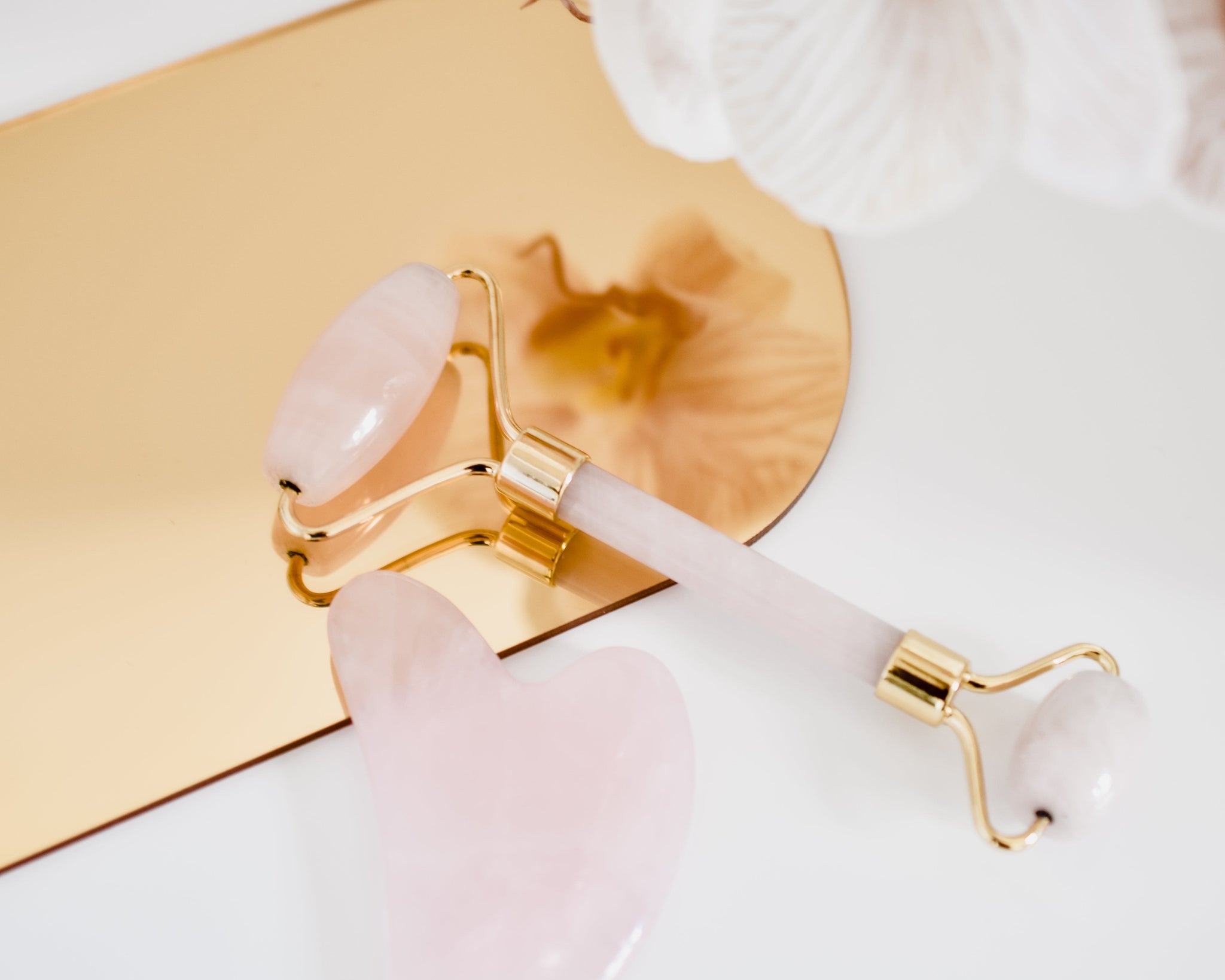 beauty tools on rose gold mirror arch prop - backdrop collective