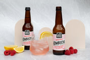 Industrial concrete double-sided backdrops with beige arches photographed with organic kombucha and fruit - Backdrop Collective