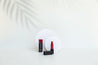 white Medium Acrylic Circles and white palm shadow vinyl photography backdrop with red lipstick prooduct photography - backdrop collective 