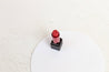 white circle acrylic props with Morphe red lipstick on white concrete vinyl photography backdrop - backdrop collective Melbourne