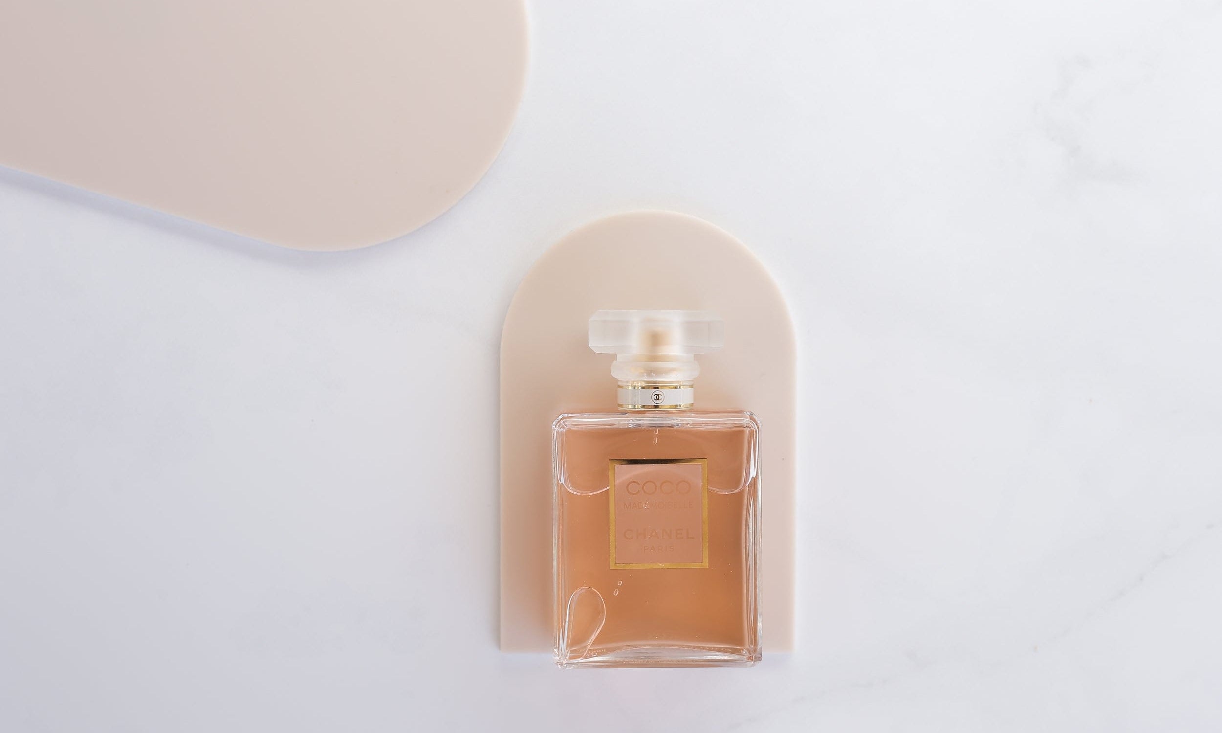 small beige arch photography props photographed with chanel perfume - backdrop collective melbourne
