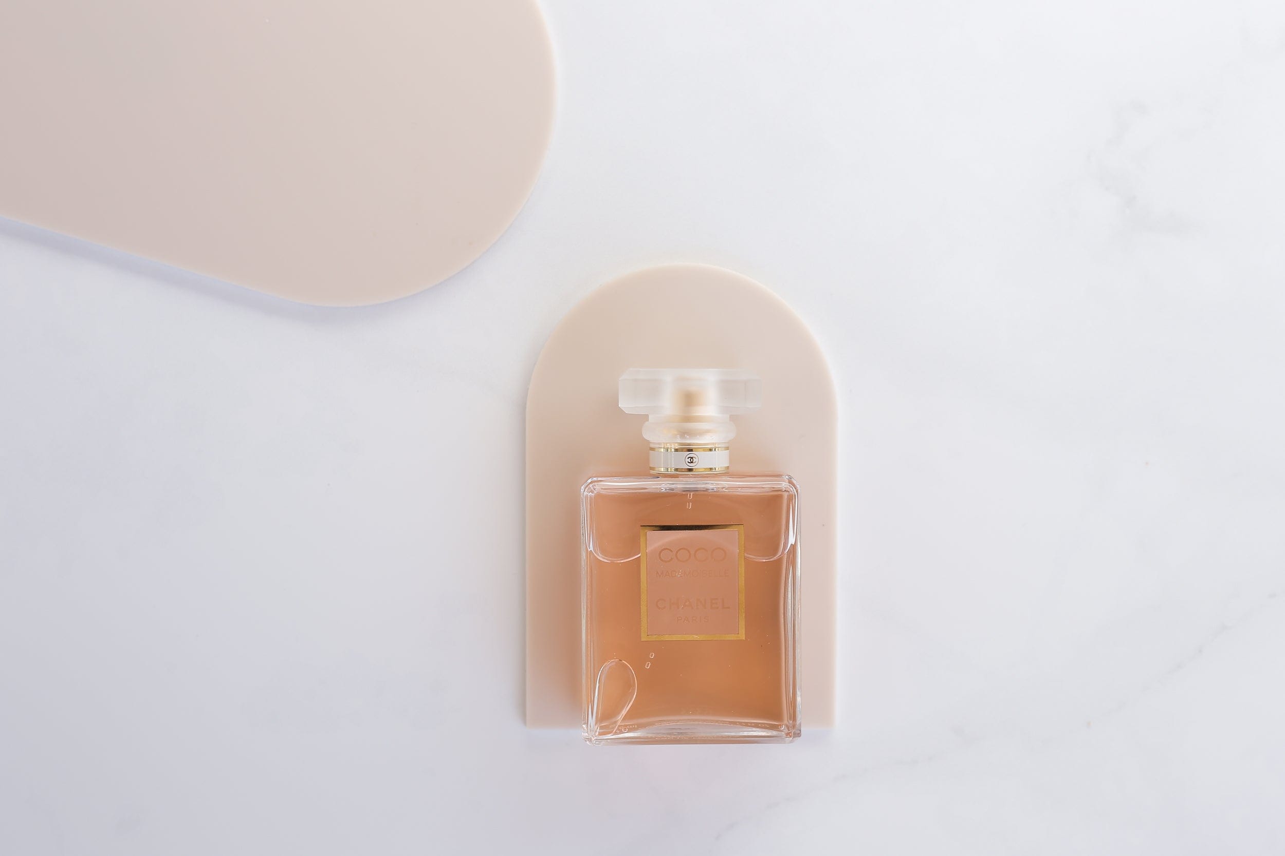 small beige arch photography props photographed with chanel perfume - backdrop collective melbourne