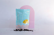 Large pink Acrylic Arch with frank body coffee scrub on pink marble backdrop - Backdrop Collective