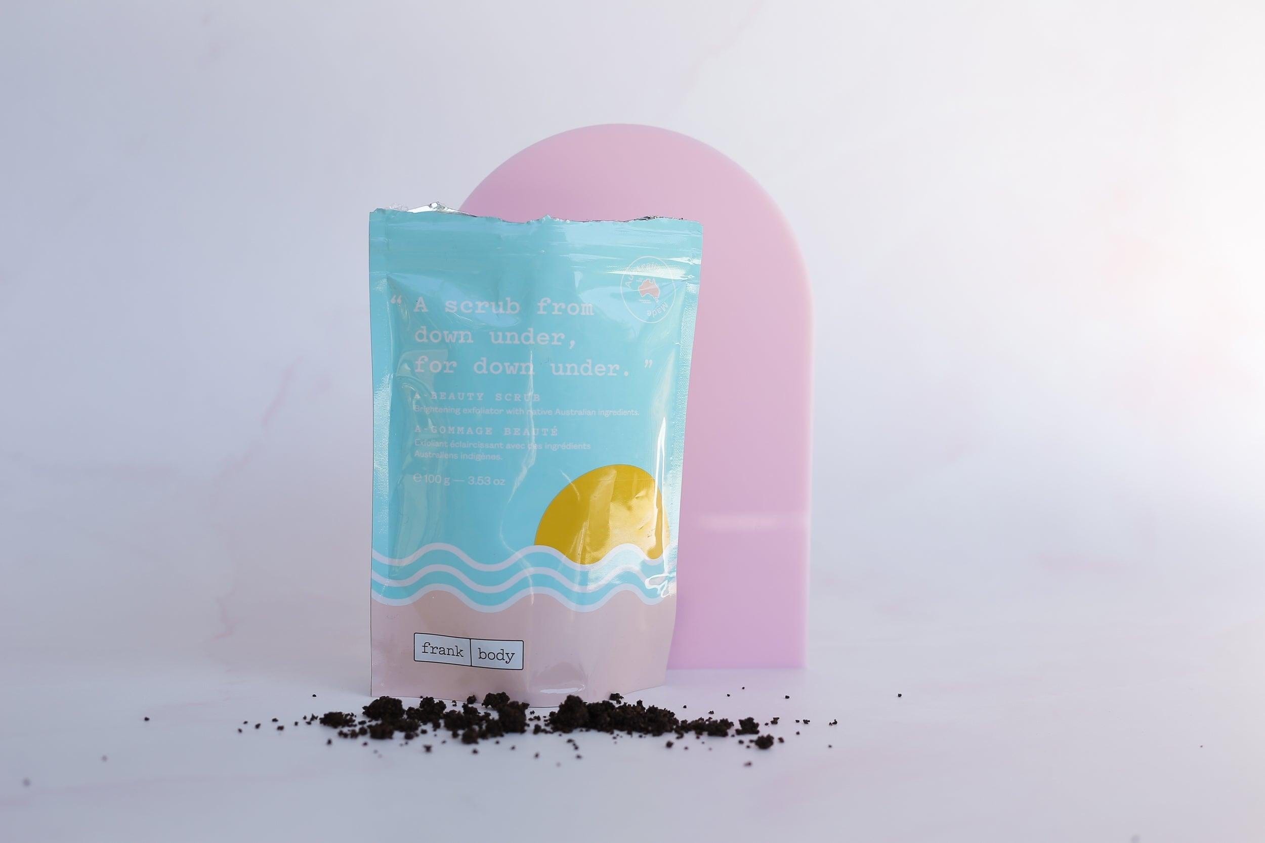 Large pink Acrylic Arch with frank body coffee scrub on pink marble backdrop - Backdrop Collective