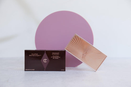 wild plum purple acrylic circle photographed with makeup on concrete vinyl backdrop - backdrop collective australia