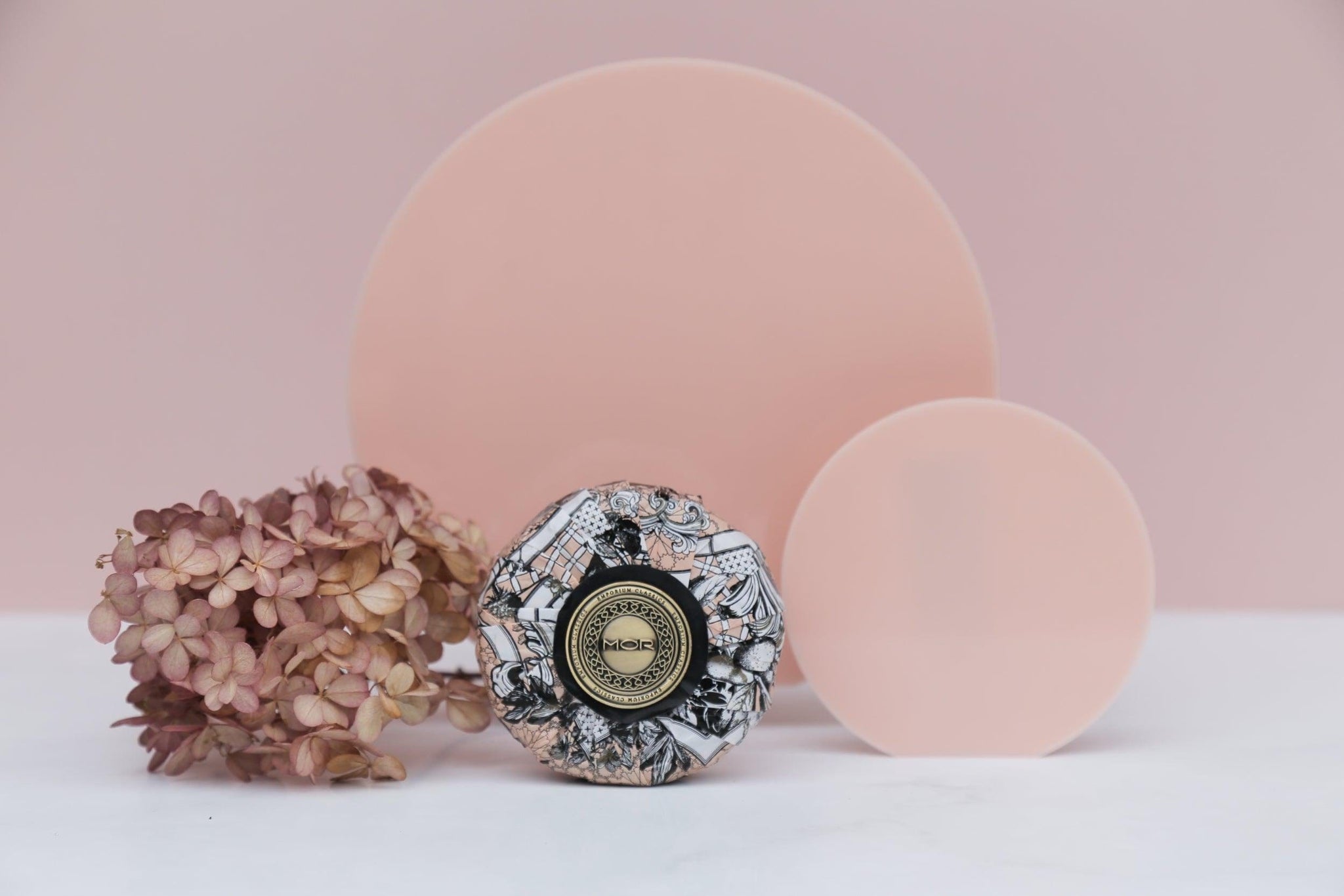 peach acrylic round props with pink vinyl photography backdrop for product photography with dried flowers - Backdrop Collective Melbourne
