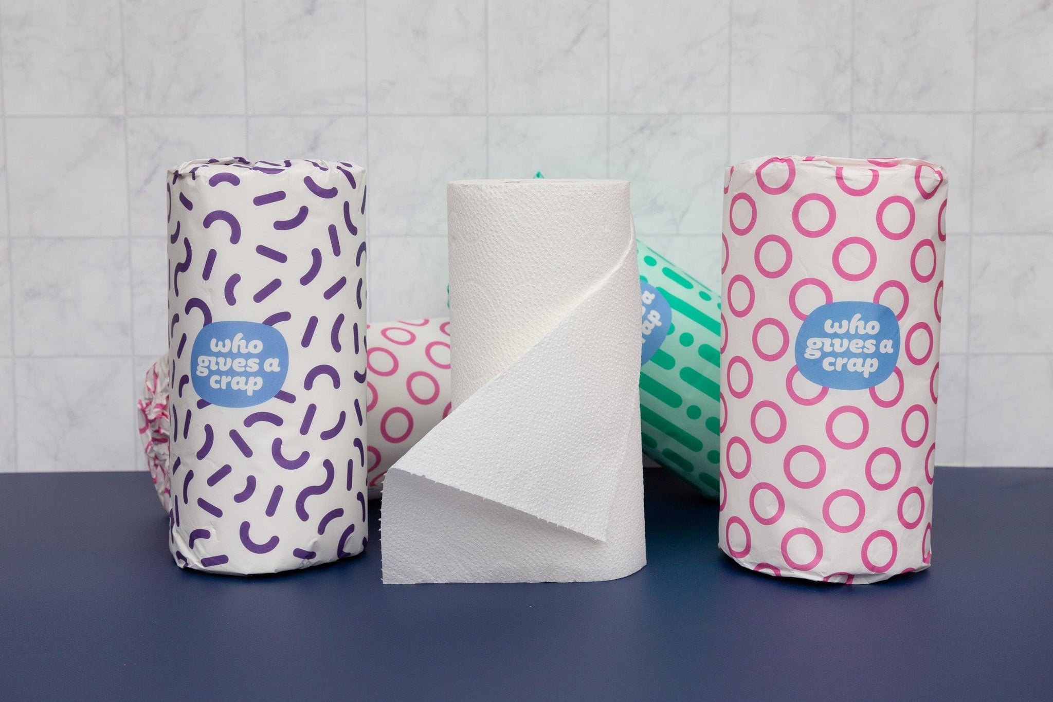 marble tile and dark blue double-sided vinyl backdrops with bathroom accessories - Backdrop Collective