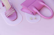 all pink vinyl photography backdrop and light link acrylic arches with pink shoes and handbag - backdrop collective australia
