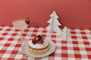 bright red photography backdrop with sponge cake and christmas props - backdrop collective melbourne