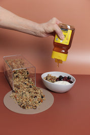 honey drip over granola and yogurt. food photography with rust coloured double sided photography backdrop - backdrop collective australia 