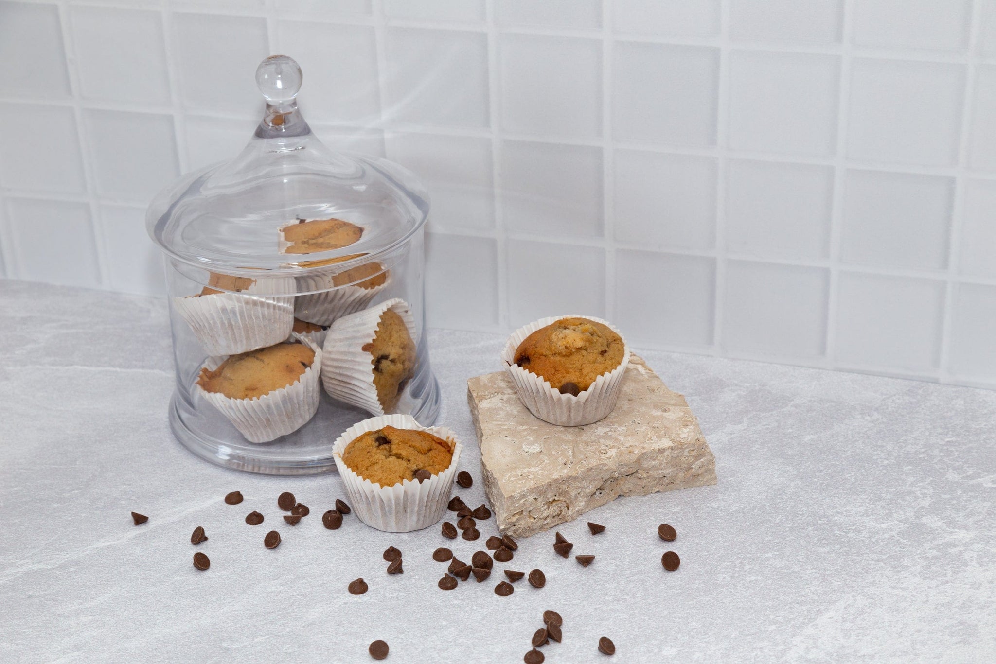 choc chip muffins with Travertine stone photography props and concrete and tile vinyl backdrop - backdrop collective australia melbourne