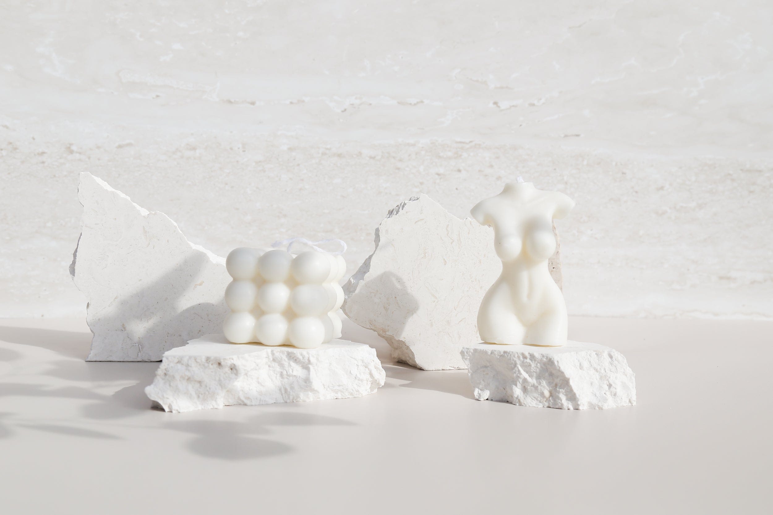 textured vinyl photography backdrops with natural stone pieces for candle product photography - Backdrop Collective Melbourne 