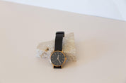 black watch and travertine stone prop on beige sand vinyl photography backdrop- Backdrop Collective