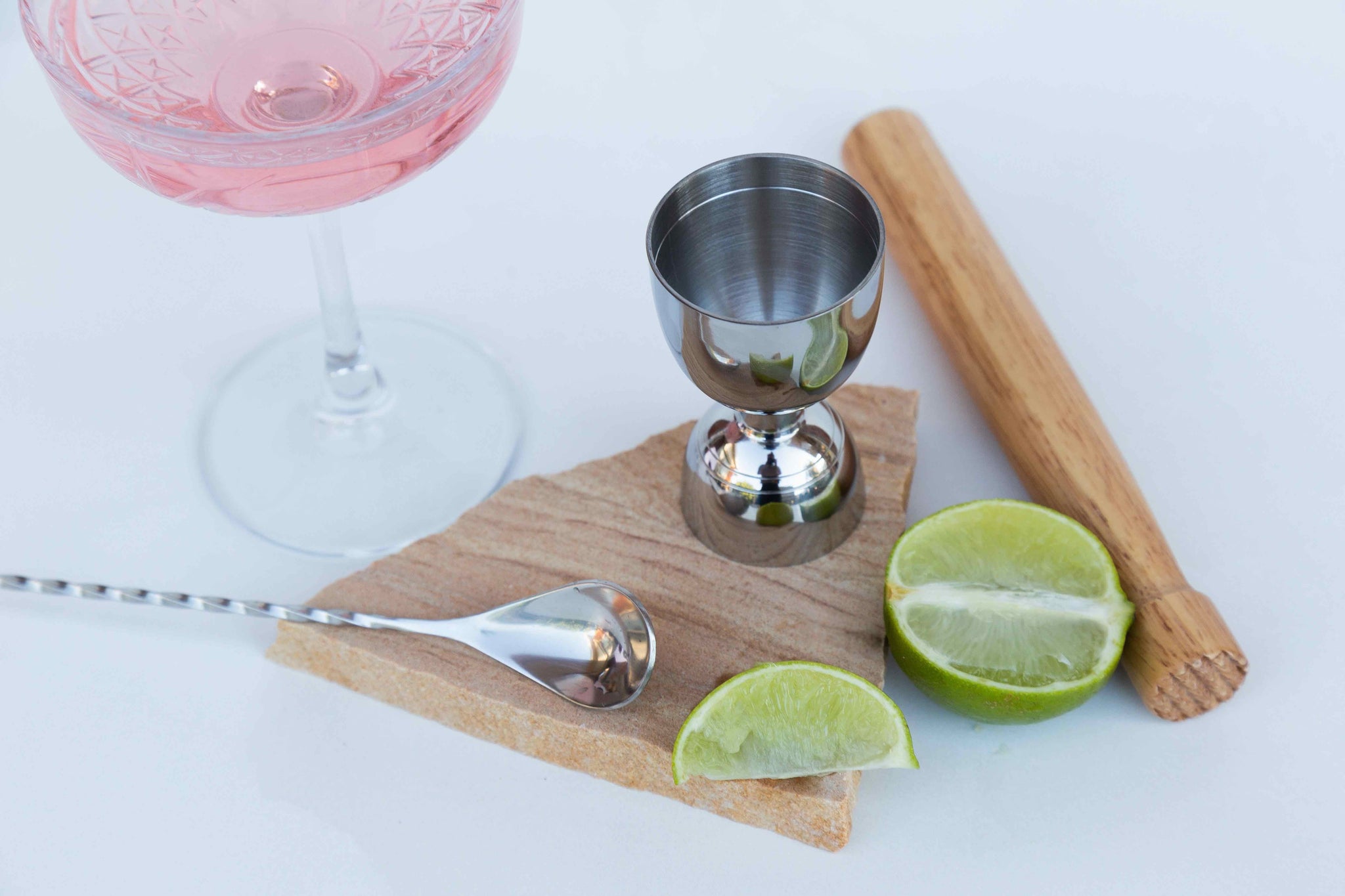 cocktail set and lime setup on Tuscan natural sandstone stone photography prop - backdrop collective Australia