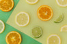 green and yellow citrus solid colour backdrop with citrus fruit and water effect- backdrop collective