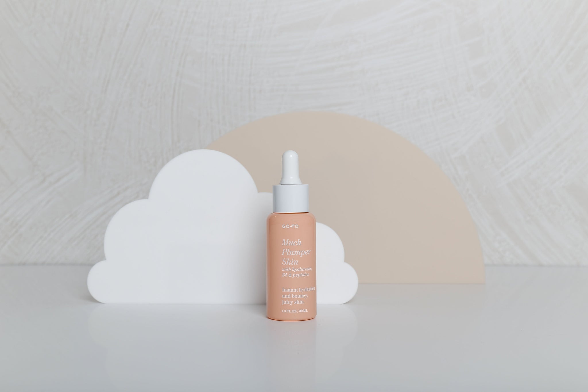 White Cloud and beige large semi circle Acrylic Prop Backdrop Collective Melbourne with Go-To Skincare products