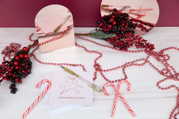 christmas photoshoot with rose gold mirrors and oak timber vinyl photography backdrop - backdrop collective