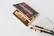 tarte eyeshadow palette and brushes on pure white double-sided vinyl backdrop - backdrop collective
