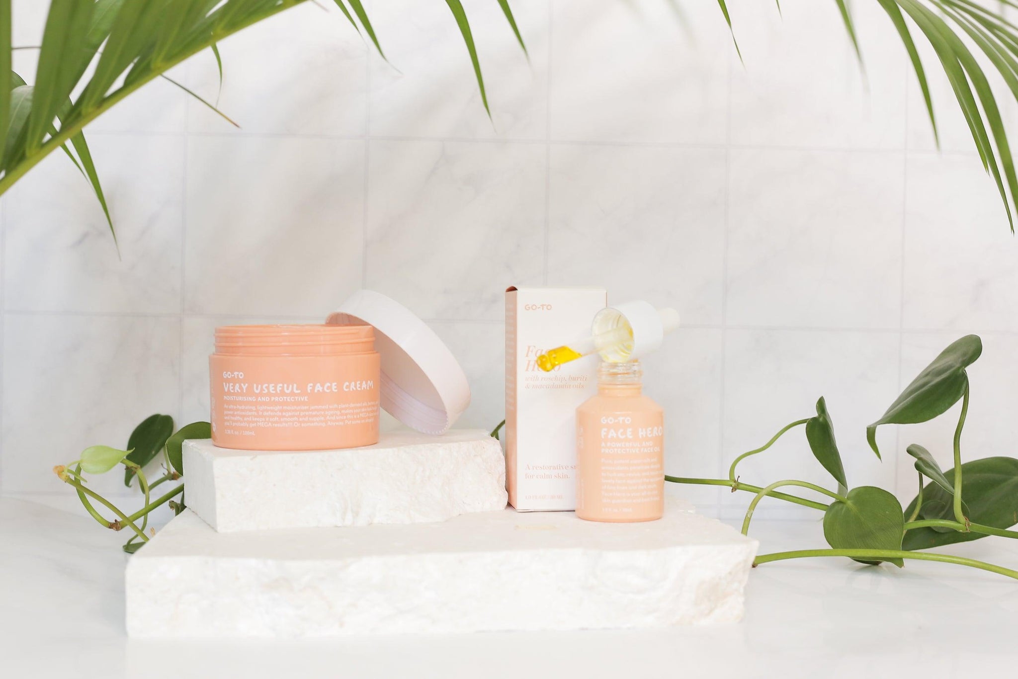 granite marble tile double-sided vinyl backdrops photographed with go-to skincare on white limestone stone props - Backdrop Collective