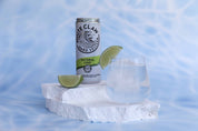 Water effect blue vinyl backdrop with white limestone natural stone prop photographed with White claw seltzer and lime - backdrop collective melbourne australia 