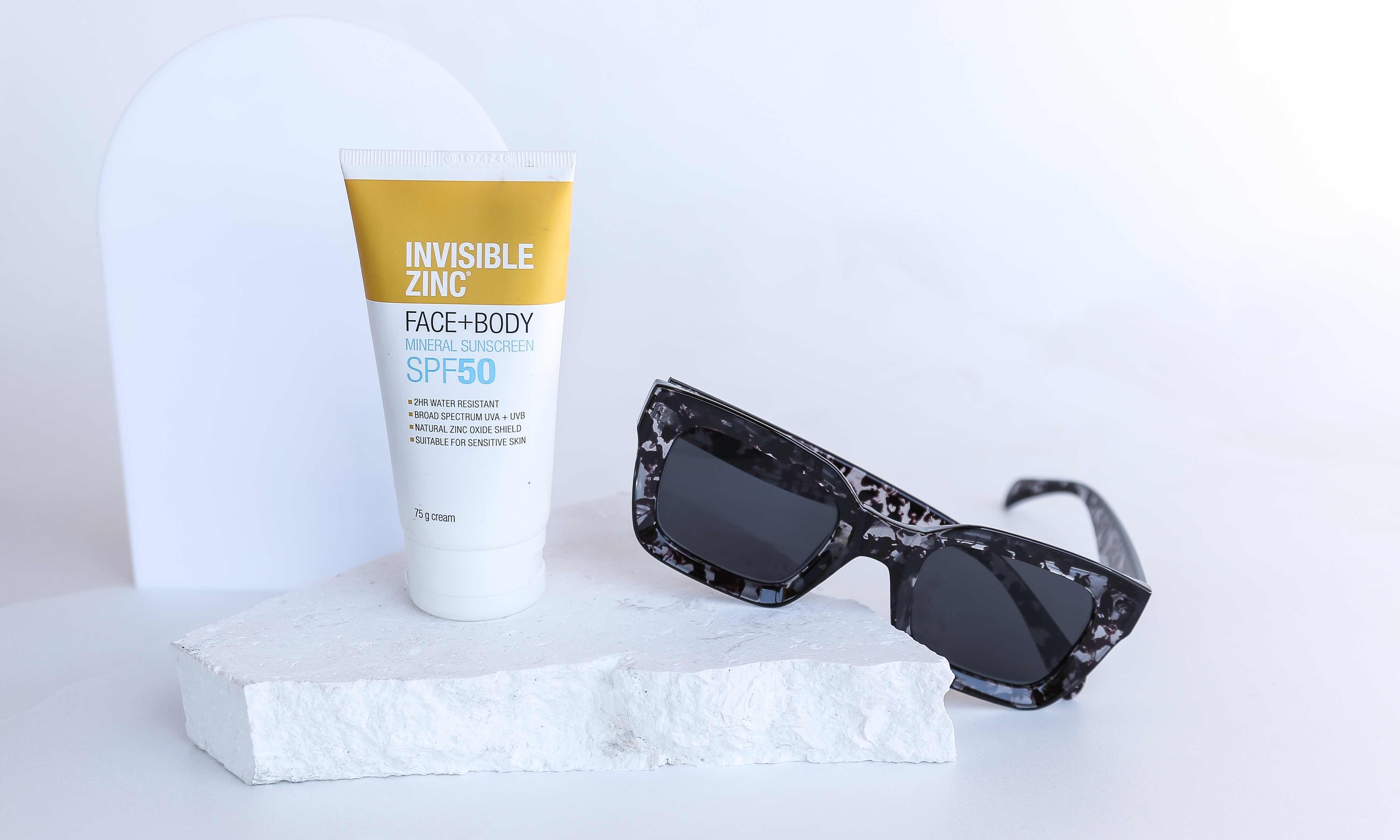 Invisible zinc and sunglasses on white limestone natural stone prop - backdrop collective melbourne australia 